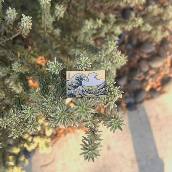 Inspired by "The Great Wave Off Kanagawa" by Hokusai, this pin depicts Hokusai's iconic ukiyo-e painting, The Great Wave Off Kanagawa. Featuring beautiful vibrant colors, this will add a touch of Japanese culture to your wardrobe. An attention-grabbing piece of art, you're sure to get compliments when wearing thi