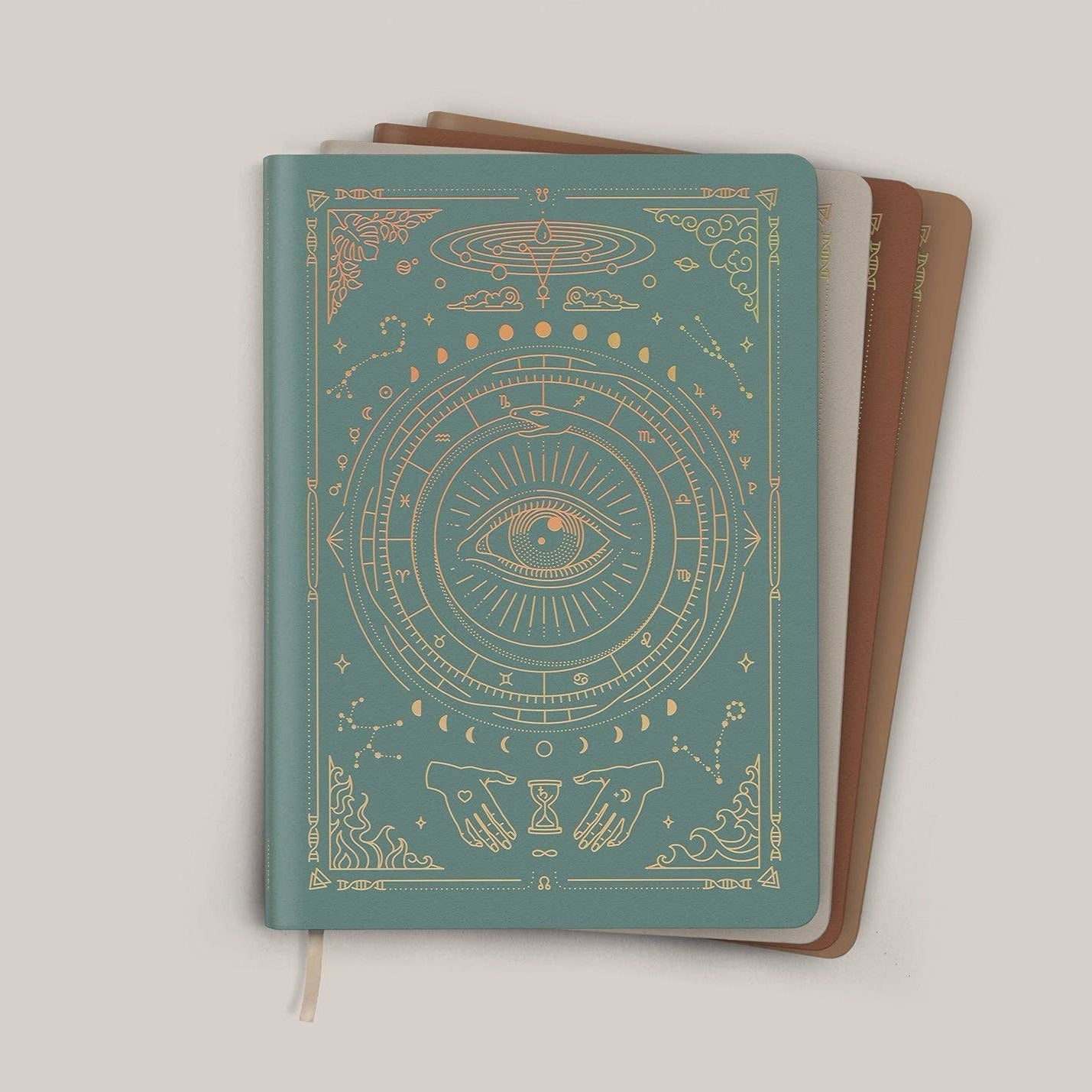 Notebook with celestial design on a beige background