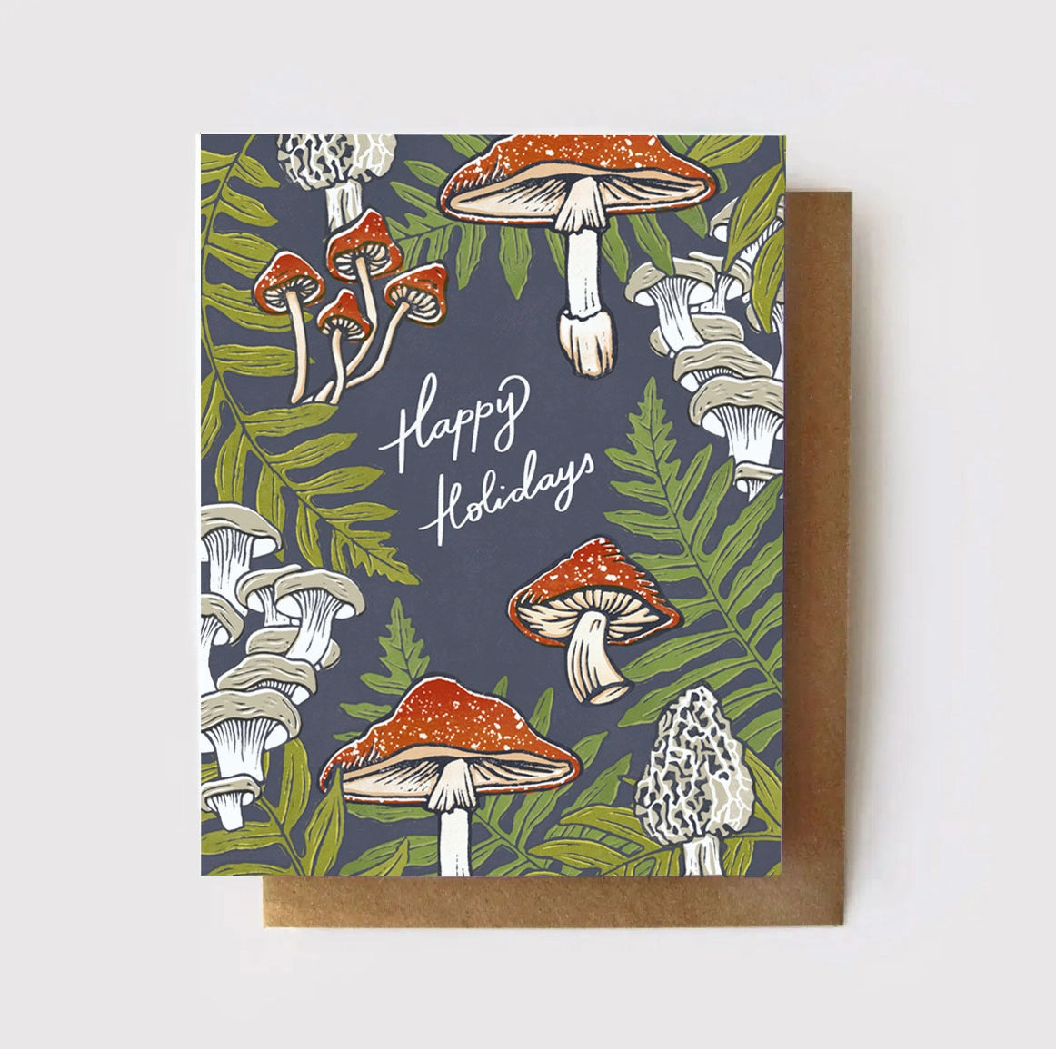 A holiday card with a navy background featuring a pattern of illustrated mushrooms and ferns, with the text 'Happy Holidays' and 'Merry Christmas' on it.