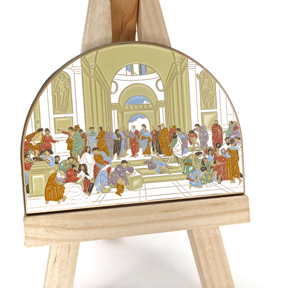 Painted by Raphael in 1509-11, The School of Athens fresco has made a lasting impact. Captivating the Vatican’s wall, this work depicts some of the greatest minds, including Plato, Aristotle, and Socrates. Whether you like art, philosophy, or history, this mega pin will bring upon compliments, smiles, and some pondering of life’s biggest questions. P.S. Can you spot where Raphael painted himself? Details: 2.75" x 2” Enamel Pin 3 Metal Locking Clasps By Pin Museum