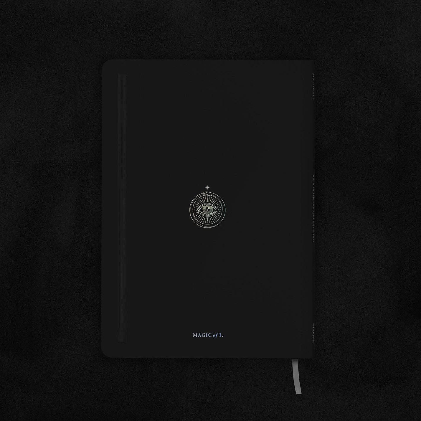 Magic of I - Zodiac Journal - Sagittarius - Black notebook with a brand logo on a dark background