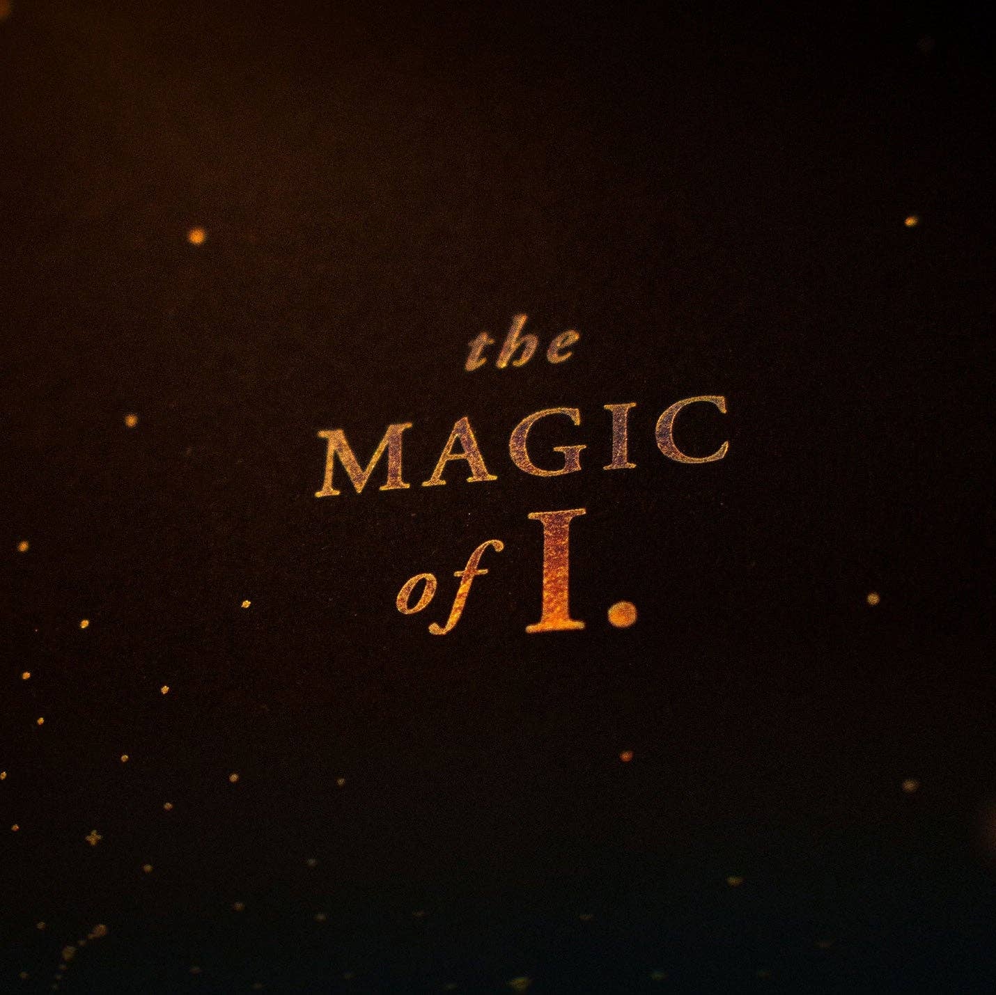 Text 'the MAGIC of I.' on a dark background with a warm glow.