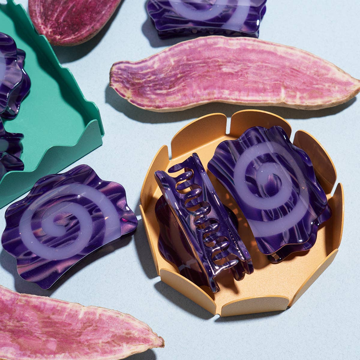 Colorful hair clips on a light blue background