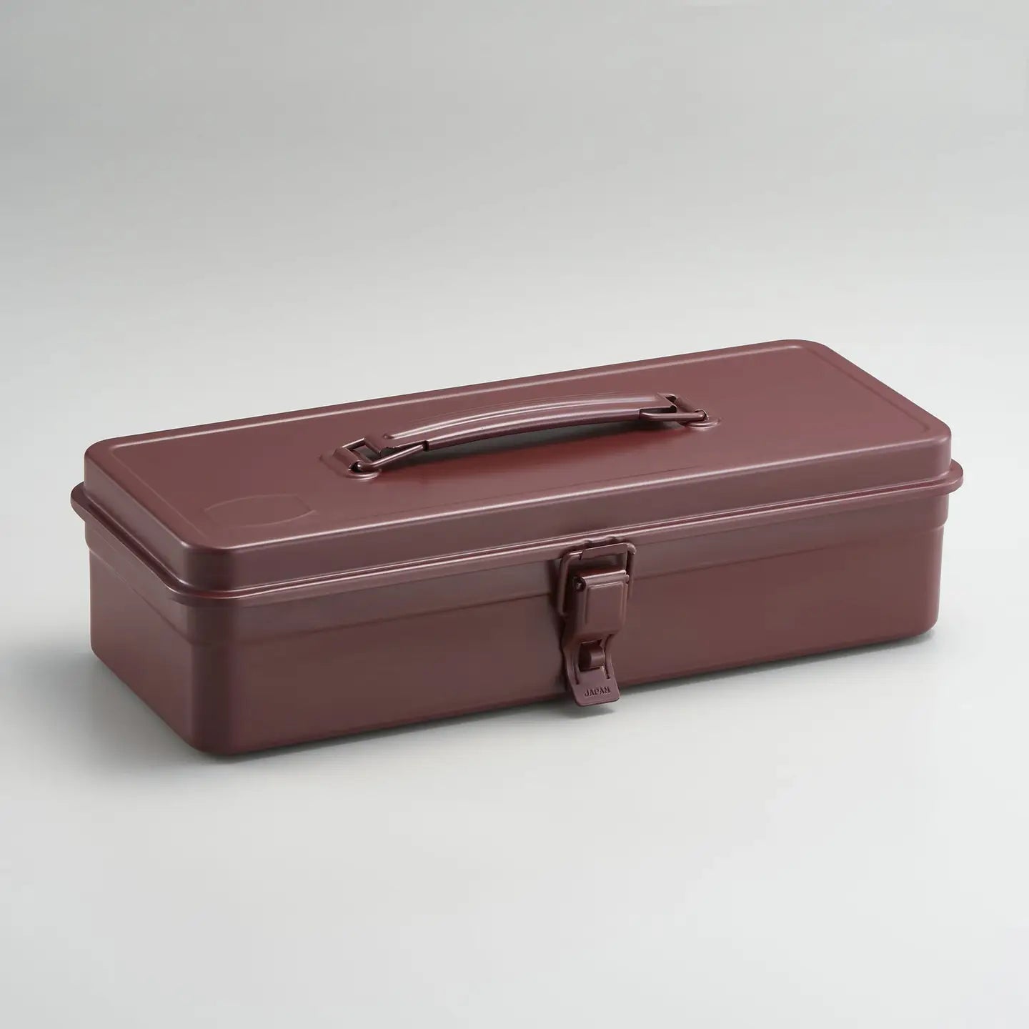 Brown metal toolbox on a light gray background