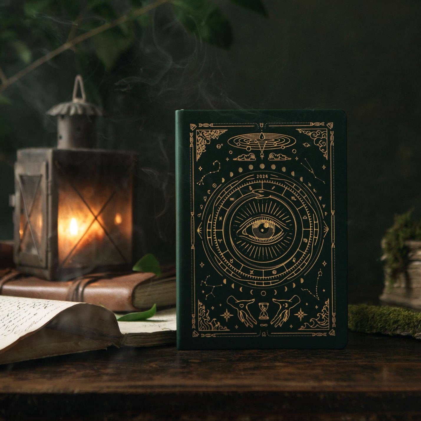 Magic of I - Decorative book with mystical design on a dark background with candles and crystals