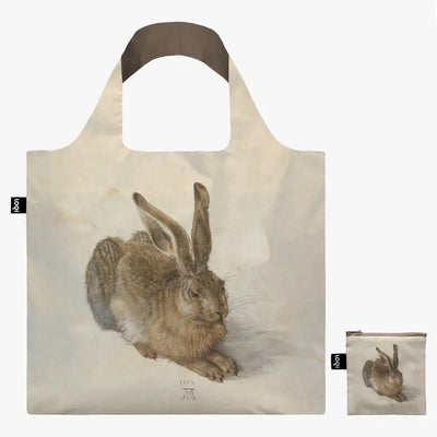 Duerer captures the hare's fur in forensic detail, falling in different directions and hues on the recycled tote bag. Reach out and feel its fluffy coat. What do you see in the twinkle of his eye? Dürer, sometimes spelled in English as Durer or Duerer, was a German painter, printmaker, and theorist of the german renaissance.  This tote bag comes in a mini, matching, self-storage tote that itself can be used for coins or small accessories if needed.