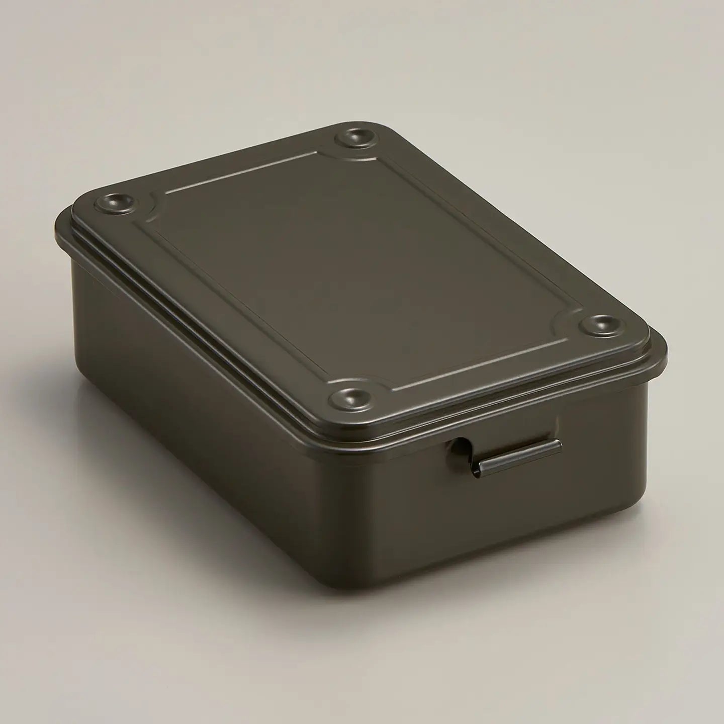 Metallic box with a lid on a gray background