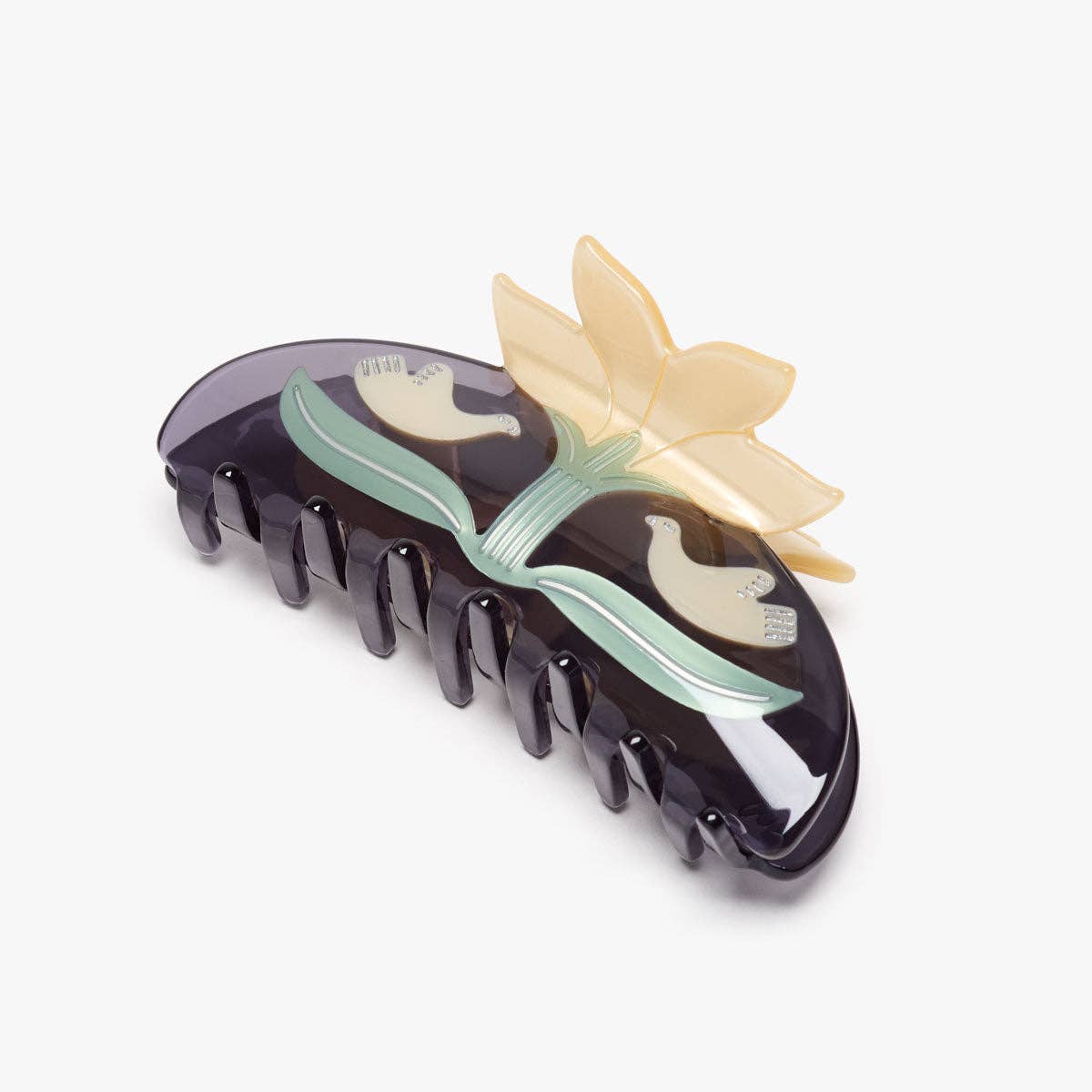 Black hair clip with floral design on a white background