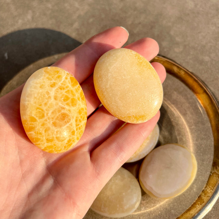 Orange Calcite - Pillow Palm Stone