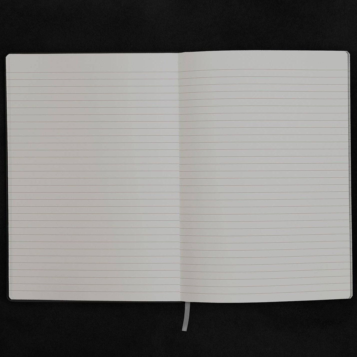Open notebook with lined pages on a black background