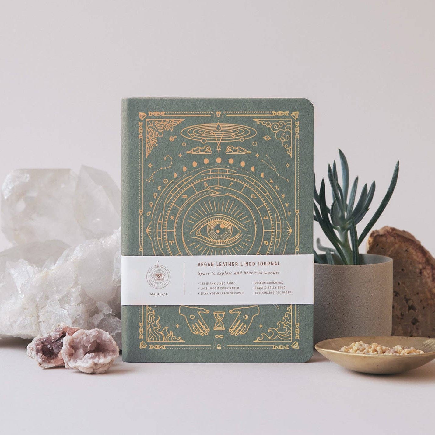 Vegan Leather journal from Magic of I - Decorative notebook with mystical design on a neutral background with plants and crystals.