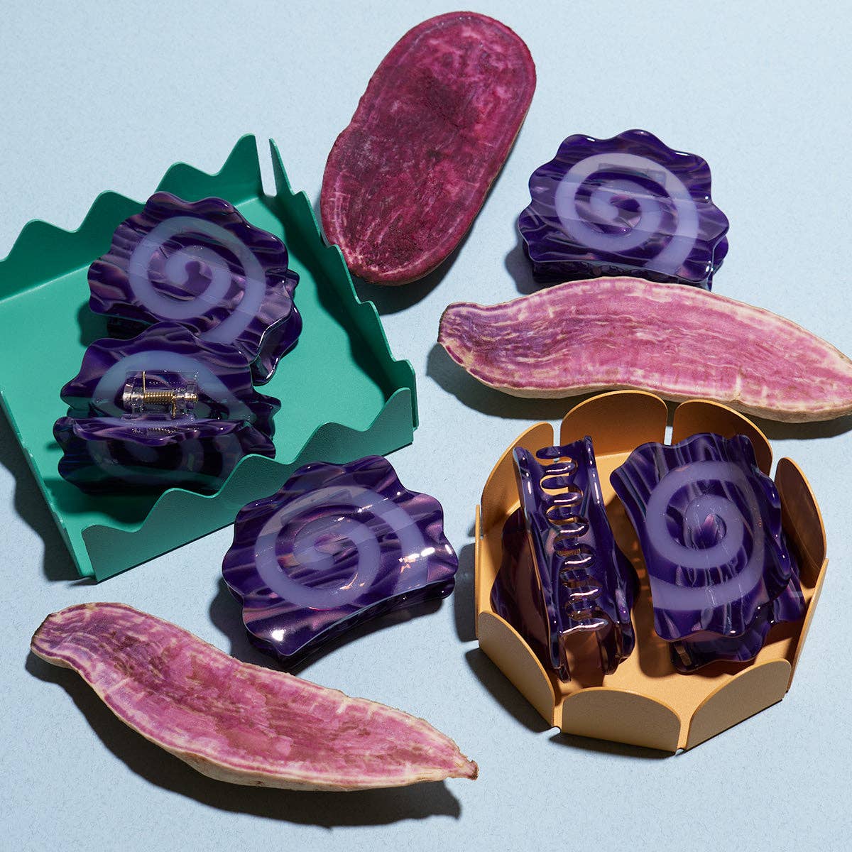 Colorful resin hair clips on a light blue background