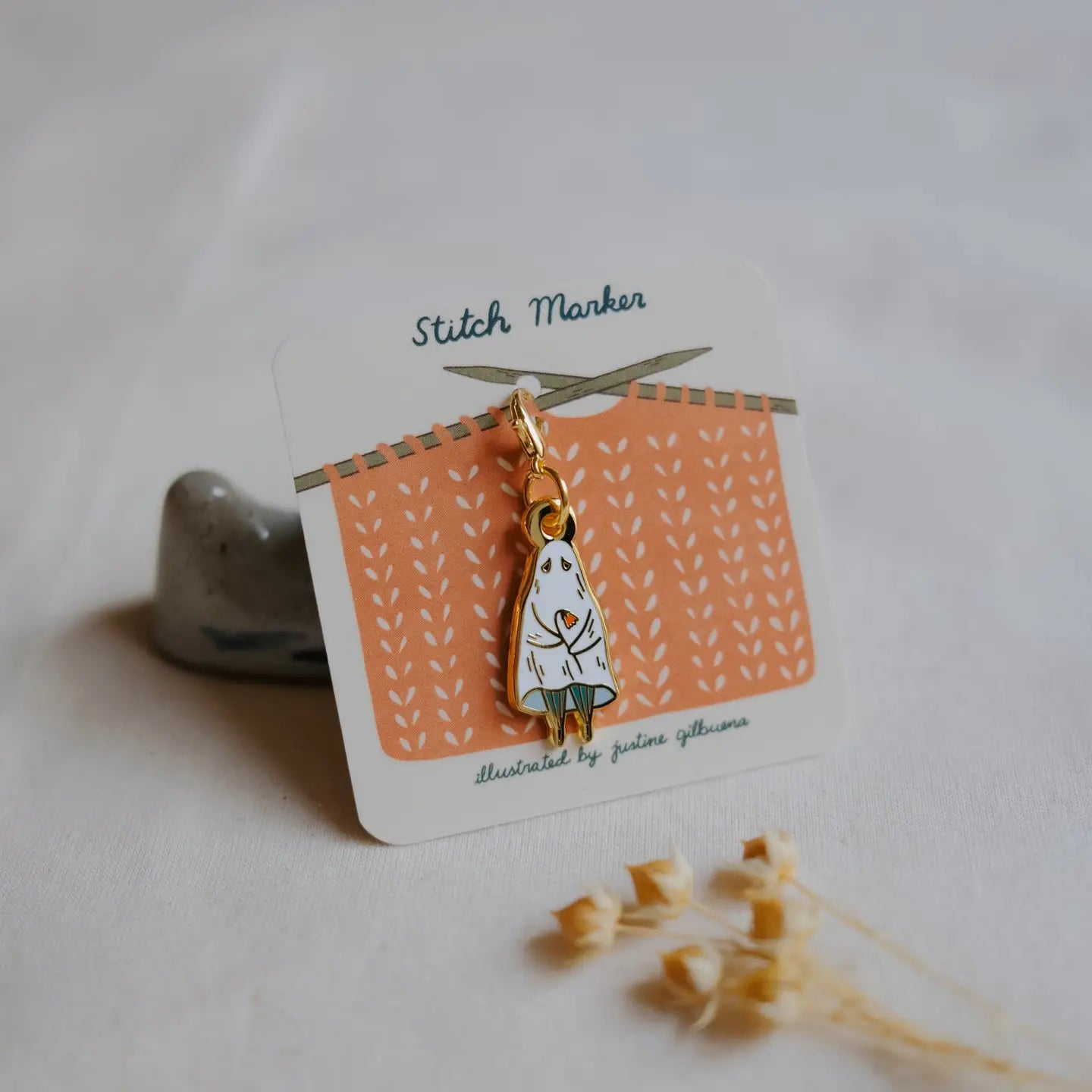 Shy Ghost Stitch Marker with a cartoon character on a patterned card, placed on a light surface.
