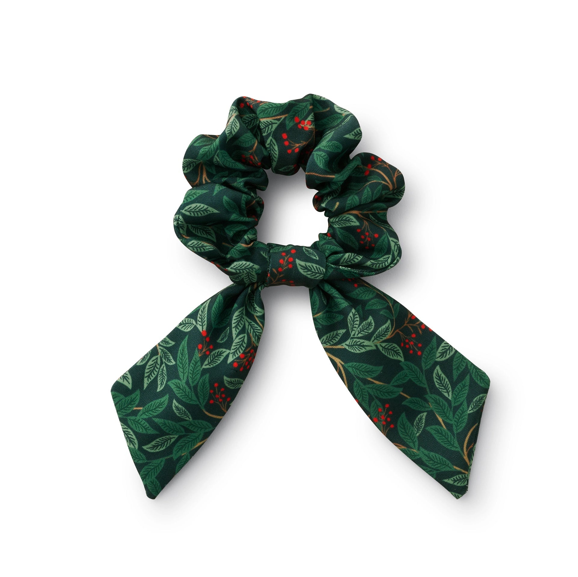 A green velvet scrunchie with a floral pattern, including embroidered cherries, displayed against a white background.