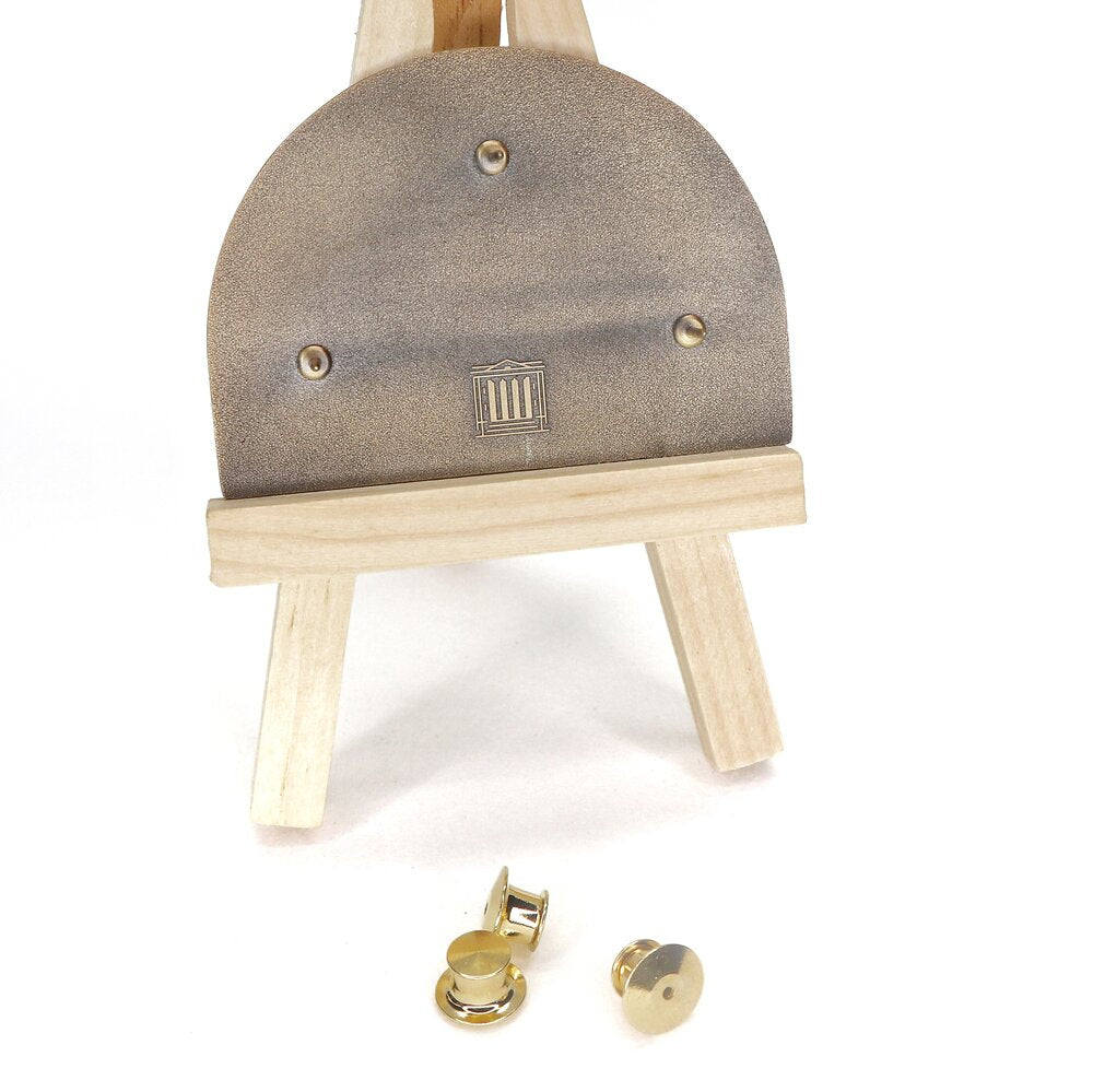 Painted by Raphael in 1509-11, The School of Athens fresco has made a lasting impact. Captivating the Vatican’s wall, this work depicts some of the greatest minds, including Plato, Aristotle, and Socrates. Whether you like art, philosophy, or history, this mega pin will bring upon compliments, smiles, and some pondering of life’s biggest questions.  P.S. Can you spot where Raphael painted himself?  Details: 2.75" x 2” Enamel Pin 3 Metal Locking Clasps  By Pin Museum