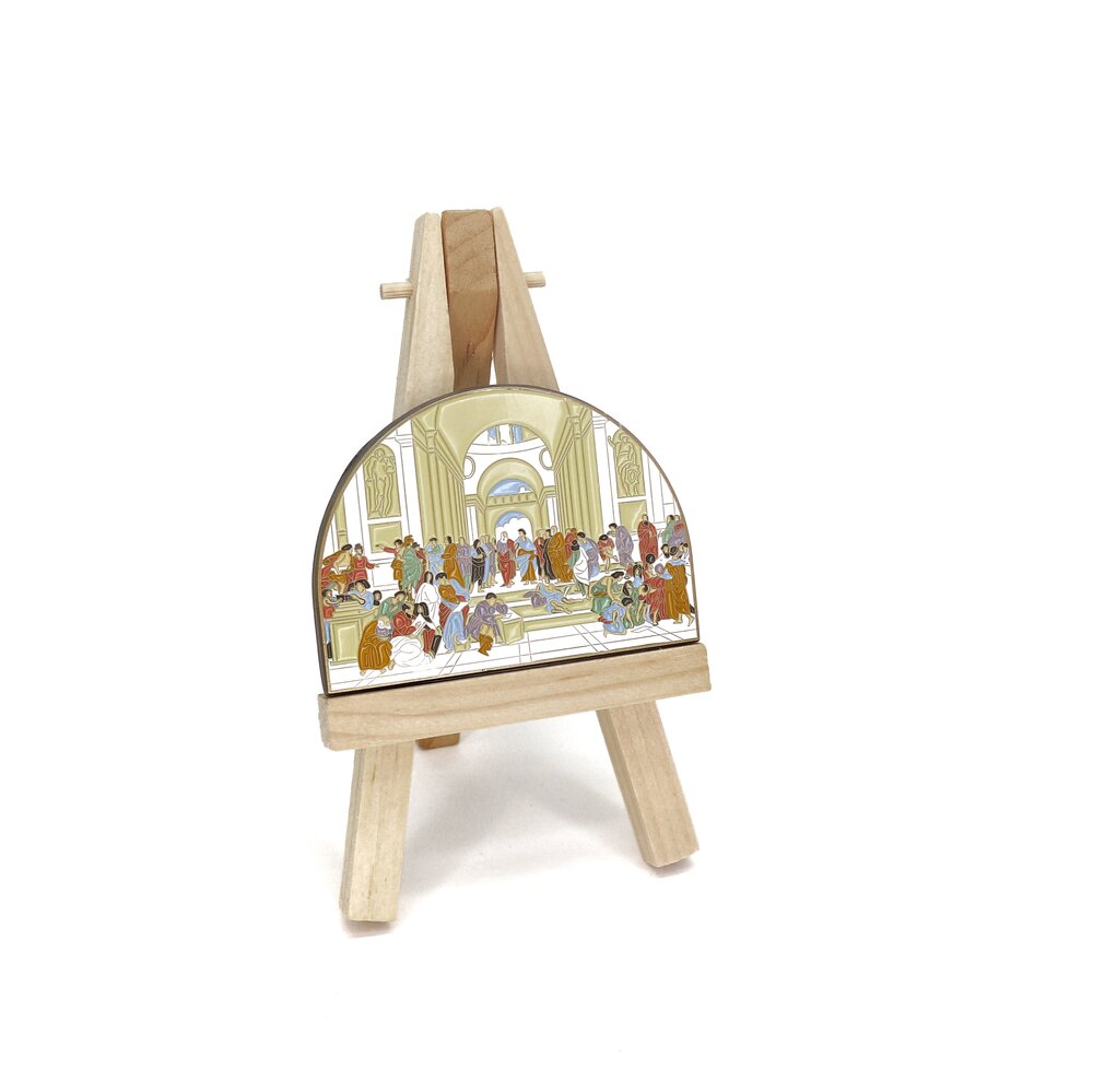 Painted by Raphael in 1509-11, The School of Athens fresco has made a lasting impact. Captivating the Vatican’s wall, this work depicts some of the greatest minds, including Plato, Aristotle, and Socrates. Whether you like art, philosophy, or history, this mega pin will bring upon compliments, smiles, and some pondering of life’s biggest questions.  P.S. Can you spot where Raphael painted himself?  Details: 2.75" x 2” Enamel Pin 3 Metal Locking Clasps  By Pin Museum